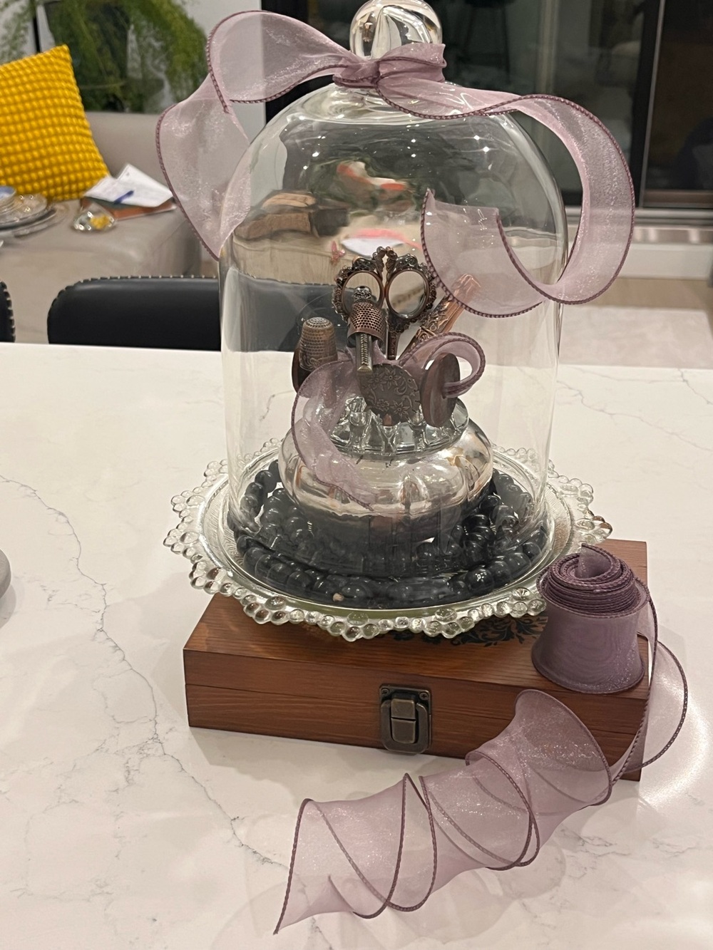 Vintage inspired Cloche with vintage look sewing motif on a vintage glass plate.